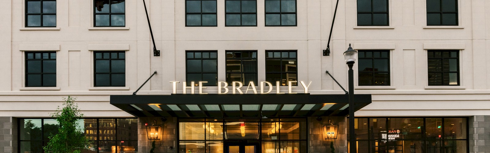 The image shows the facade of a building named 
