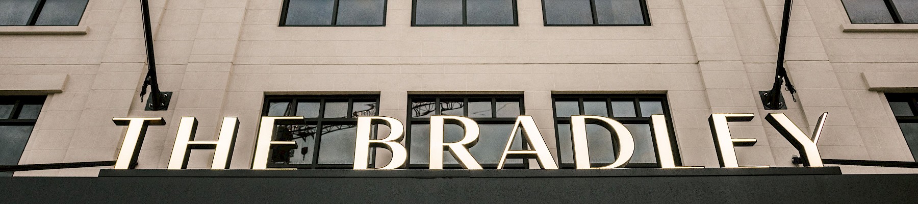 The image shows a building facade with the name 