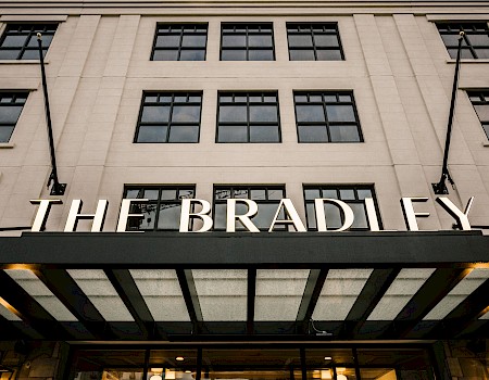The image shows a building facade with the name 